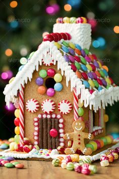 a gingerbread house with candy and candies on it's roof is shown