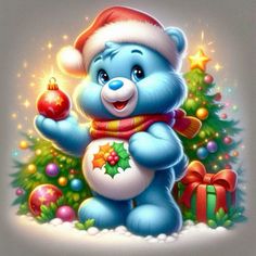 a blue teddy bear holding a christmas ornament