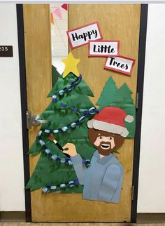 a door decorated to look like a christmas tree with a paper cut out of it