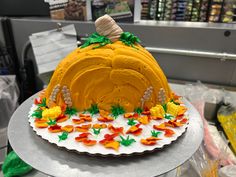 a decorated cake sitting on top of a table