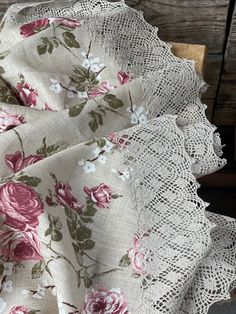 the fabric has pink roses on it