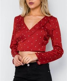 Long sleeves Crop Length Red with cream polka dot print Also available in cream Surpliced V-neckline Side button closure inside and outside in wrapped style 100% Polyester No stretch Unlined Model is 5’9 wearing a size Small ( Waist: 26”, Bust: 32C, Hips: 34”) Small measures approximately: Length: 16”, Bust: 34“ Sleeves: 22" Long Sleeve Cropped Top, Dots Fashion, Polka Dots Fashion, Boatneck Sweater, Trendy Clothes For Women, Wrap Blouse, Crop Blouse, Polka Dot Print, Red Blouses