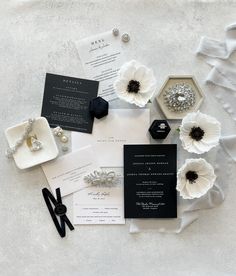 an assortment of wedding stationery and jewelry