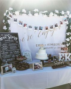 a table topped with a cake and pictures