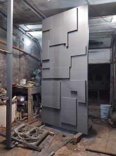 an unfinished room with several pieces of metal on the floor