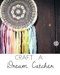 a crocheted dream catcher hanging on a wooden wall with the words craft a dream catcher below it