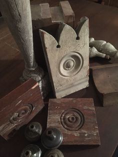 an assortment of wood and metal objects on a table