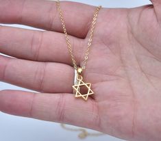 Jewish star necklace made of 21K gold-filled Judaica jewelry Handmade Jewish spiritual necklace. Spiritual Jewish gift Handmade Star of David jewelry Gift for Dad Gift for Mom Gift for Woman Gift for Man A gift for Hanukkah A gift for Valentine's Day Spiritual Gold Jewelry With Star Charm, Yellow Gold Star Of David Charm Necklace Gift, Yellow Gold Star Of David Charm Necklace, Gold Plated Star Of David Necklace As Gift, Spiritual Gold Star Of David Jewelry, Gold Star Of David Necklace For Gift, Gold Star Of David Charm Necklace For Gift, Gold Star Of David Charm Necklace As Gift, Gold Star Of David Jewelry Gift