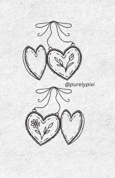 three hearts with flowers on them and the words love written in black ink above them