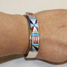 Glacier Wear : Fine Furs and Leather Since 1991Ornamental Inlay Cuff Braceletjwl1104Inlay Cuff Bracelet with Mother of Pearl, Onyx, Lapis, Turquoise and CoralNew Southwestern Native American Sterling Silver Cuff Bracelet.One of a kind, truly special and unique.Approx. 2 3/4" wide by 5/8" high.Internal circumference approximately 7 1/4".We also stock the largest inventory of tanned furs and leather hides in North America. Visit us at Glacier Wear. Luxury Sterling Silver Inlay Cuff Bracelet, Luxury Bohemian Cuff Bracelet With Inlay, Luxury Adjustable Inlay Bracelets, Traditional Luxury Cuff Bracelet With Inlay, Traditional Inlay Cuff Bangle Bracelet, Adjustable Multicolor Cuff Bracelet For Formal Occasions, Multicolor Adjustable Cuff Bracelet For Formal Occasions, Southwestern Multicolor Cuff Bangle, Silver Inlay Cuff Bracelet Bangle