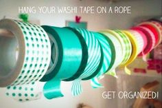 there are many different colored tapes hanging on the wall and one is labeled hang your washi tape on a rope get organized