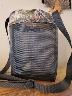 This listing is for a small bag. (patterns vary) pattern either camo Bags are made from a heavy duty screen that is tear resistant and will allow for spores to disperse. they are great for the beach, sand falls right through. Also prduce, berry picking, rock collecting, ect. They have a nylon strap to go across the body for hands free picking (some sizes are adjustable).  Colors depend on what is available to me. Once I sell through a color I can not guarantee more will be available.  Sizes: Basic- approximately 12" x 11.5" with a non-adjustable strap $12.00  Small- (cut size 12"x 12") Finished size approximately 10"x7"x4" with adjustable strap $14.00 medium - (cut size 15"x 15") Finished size approximately 13"x9"x5" with adjustable strap $16.00 large - (cut size 18"x 18") Finished size ap Berry Picking, Medium Cut, Durable Practical Camping Bag, Durable Pouch Bags For Outdoor, Durable Outdoor Pouch Bag, Practical Reusable Bags For Outdoors, Practical Camping Bag With Adjustable Strap, Camo Bags, Rock Collecting