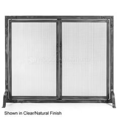 a black metal fireplace screen with two doors