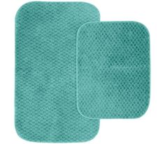 two aqua green bath mats on a white background