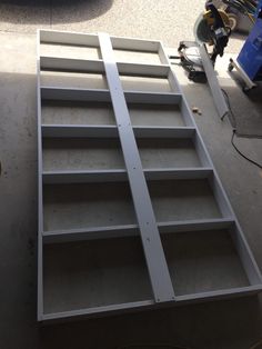 the shelves are ready to be assembled and put together in the garage for painting or decorating