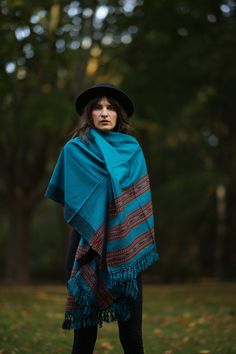 Discover the charm of our beautiful scarf with ethnic patterns and symbols! This cozy and versatile accessory can be worn as a stole, scarf, blanket, or decoration.  Crafted from luxuriously soft wool (50%) and viscose (50 it provides warmth and features vibrant colors and fascinating patterns that elevate any outfit. Unisex and adorned with fringes, this scarf is the perfect companion in chilly weather.  Measuring 100 cm in width and 210 cm in length (excluding fringes), it offers diverse styling possibilities. Available in 5 colors/patterns (Red, Dark Red, Turquoise, Dark Blue, Beige) and sourced on a Fair Trade basis, this accessory is not only stylish but also ethically conscious.  Surprise your loved ones with the perfect Christmas gift! ※ ---›Dimensions‹---  Width: 100 cm Length: 210 Folk Style Handwoven Shawl, Handwoven Folk Shawl One Size, Fall Bohemian Pashmina Shawl In One Size, Bohemian Shawl Scarves For Fall, Bohemian Pashmina Scarf One Size, Bohemian Pashmina Shawl For Fall, Bohemian Pashmina Scarves, Hippie Winter Shawl, Bohemian Winter Pashmina Shawl One Size