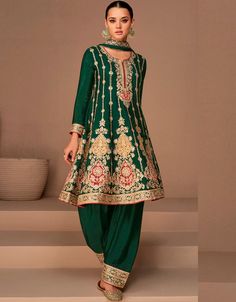 "Indulge in the richness of style with this enchanting Dark Green Pant Style Salwar Kameez. The deep green hue and the modern pant style design of this semi-stitched ensemble exude elegance and sophistication. Step into a world of timeless beauty and let your fashion sense make a statement. 🌿✨" #DarkGreenSalwarKameez #PantStyleEnsemble #EnchantingCharm #Fashionista #SophisticatedStyle #SpecialOccasionAttire #ConfidentLook Silk Pant Suit, Dark Green Pants, Patiala Suit Designs, Celana Fashion, Green Wedding Dresses, Modest Evening Dress, Frock Style, Patiala Suit, Salwar Kamiz