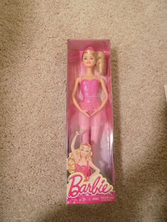 the barbie doll is in its box on the floor