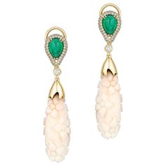 These White Coral Flower Engraved Earrings with Emerald and Diamond Tops in Yellow Gold are a stunning pair of earrings from the 'G-One' collection. The earrings feature engraved flowers in the white coral, which dangle elegantly from a top section set in yellow gold. The combination of the delicate floral design with the luxurious emerald gemstones and gold creates a truly unique and eye-catching piece of jewelry that is sure to impress. These earrings are perfect for adding a touch of elegance and sophistication to any outfit. * Gemstone: 100% Earth Mined * Approx. gemstone Weight: 2.75 Carats (Emerald), 32.50 Carats (White Coral) * 100% Natural Earth-Mined Diamonds * Carat: Approx.: 0.50 Carats * Color: G/H * Clarity: VS * Cut: Carved * Metal: 18K Yellow Gold Pink Diamond Earrings, Coral Jewellery, Haute Jewelry, Emerald Diamond Earrings, Diamond Tops, Queen Earrings, Coral Flower, Engraved Earrings, Engraved Flower