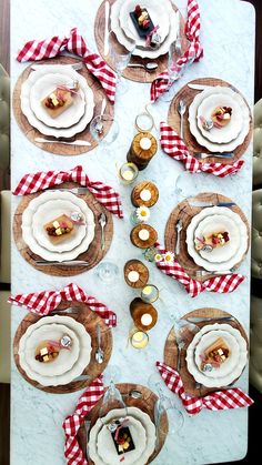 the table is set with plates and silverware