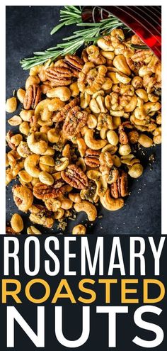 rosemary roasted nuts on top of a black surface with the words rosemary roasted nuts above it