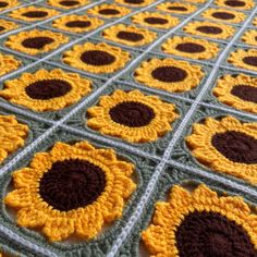 a crocheted blanket with sunflowers on it