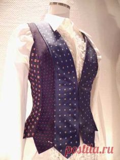 a woman's dress shirt and tie on display in a store window, with the words posita - ru written below it