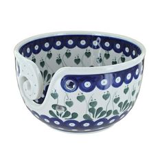 a blue and white bowl sitting on top of a table