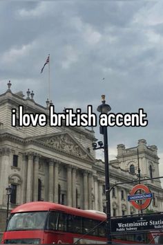 a red double decker bus driving past a tall building with the words i love british accent