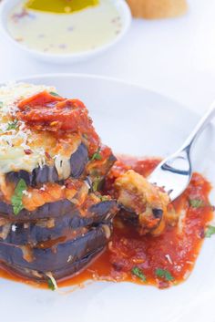 an eggplant dish with tomato sauce and parmesan cheese