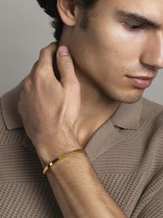 Bangle in Stainless Steel with Gold Plating Product code: MBANG_061 Designer's Notes This subtle, sleek bangle is an easy way to add an instant elegant touch to your look. Crafted from strong stainless steel with a lustrous gold finish, this timeless everyday piece can be worn solo or opposite your favorite watch. Chain Bracelets For Men, Bangle For Men Gold, Mens Bangles Gold For Men, Kada Bangles Gold Design Men, Men’s Bracelets In Gold, Bracelets Gold For Men, Bracelet Designs For Men In Gold, Gold Bracelet Designs For Men, Men Gold Kada