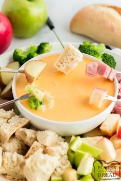 the best ever cheese fondue recipe is made with apples, broccoli and ham