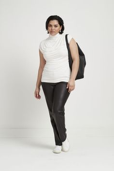 It's time to go out again! The problem? We all need new elegant but memorable separates. Meet our Delancey Top, a masterclass in minimalist exuberance. Fashioned from eco-friendly European jersey, she features a high neckline that cascades to draped detail below and fitted cap sleeves, gracefully framing your figure. Going Out Tops // Date Night Tops // Summer Tops // Minimalist Outfit // Minimalist Wardrobe #summertops Outfit Minimalist, Night Tops, Top Clothing, Cap Sleeve Top, Minimalist Wardrobe, Night Wear, Long Sleeve Turtleneck, Black Fits, Minimalist Outfit