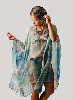 "Blue Silk Caftan - Sheer Silk Cover Up - Resort Wear - Wearable Art Poncho - Sheer Caftan - Plus Clothing Original design was hand painted on silk. This is a print from the original painting by Tina Gleave. This is a continuous pattern. Each wearable varies slightly as the pattern may adjust for different placements. This wearable is made to order and needs (3-5 days) for cutting, sewing, stitching, packaging and mailing. We use USPS First Class Mailing (typically arrives in 2-6 days in US). If Festive Garland, Gold Garland, Continuous Pattern, Silk Caftan, Cape Fashion, Beach Caftan, Beach Kaftan, Ladies Poncho, Silk Kaftan