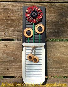 a wall hanging made to look like an art piece with speakers and a flower on it