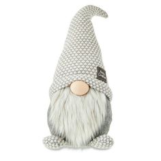 a stuffed gnome with white hair and beard