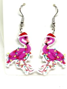 These cute Christmas Flamingo Earrings feature a bright pink flamingo wrapped up in Christmas lights and wearing a Santa hat.  Makes a great gift for your flamingo loving friends. Adjustable Pink Holiday Jewelry, Adjustable Pink Jewelry For Holiday, Handmade Pink Jewelry For Holiday, Pink Earrings Christmas Gift, Pink Adjustable Christmas Jewelry, Pink Earrings As Christmas Gift, Pink Earrings For Christmas Gift, Christmas Flamingo, Earrings Bird