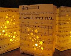 three lit up sheet music sheets with stars on them and the words twinkle little star