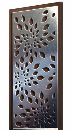 a metal panel with holes in the middle and an intricate design on it's side