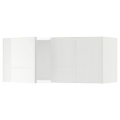 an open white cabinet with doors and drawers