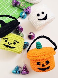 crocheted halloween decorations including candy, candies and marshmallows on a table