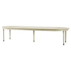 a white table sitting on top of a wooden floor