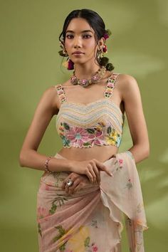 Pink pre-draped saree featuring all-over flower print and ruffle detailing. Paired with a padded blouse adorned with floral motifs and linear hand embroidery, along with an embroidered belt., Fit: Relaxed Ruffle Sarees, Draped Saree, Hand Flower, Satin Hands, Pink Floral Blouse, Ruffle Saree, Embroidered Belt, Padded Blouse, Hand Flowers