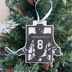 a hockey ornament hanging from a christmas tree