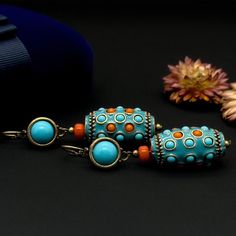 Product Details: Vintage Ethnic Turquoise Thangka Earrings; Length: 65 mm; Width: 16 mm; Weight: 32 grams; Material: Copper (18K Gold Plated), Turquoise, Enamel; Handmade with Vintage Craftsmanship; Comes with a Gift Box. Customer Service: Should you have any questions, please leave a message, and I am more than happy to assist you. Additionally, if you are not satisfied with your purchase, please do not hesitate to reach out to me. About Us: We are enthusiasts of traditional craftsmanship and h Earrings Turquoise, Handcrafted Art, Ethnic Style, Earrings Vintage, Style Earrings, Turquoise Earrings, Ethnic Fashion, Vintage Earrings, Favorite Things List