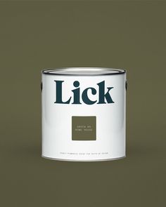 a white paint can with the word lick on it's side and a black background