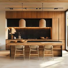 a modern kitchen with wooden cabinets and black counter tops, along with white chairs in front of the island