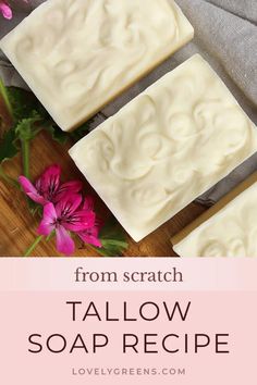 three soap bars sitting on top of a wooden cutting board with flowers in the background