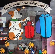 a store front window with an image of a dog holding a fire extinguisher