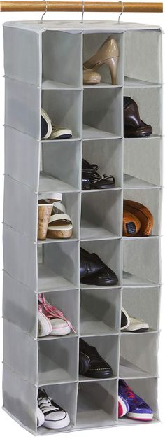 the shoe rack is organized with several pairs of shoes